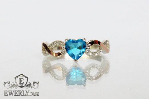 Silver ring with heart of light blue stone, фото